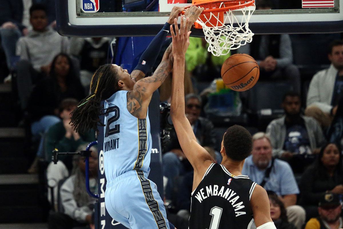 Memphis Grizzlies Guard Ja Morant (12) Dunks via San Antonio Spurs Center Victor Vembaniama (1) During the second half in FedExforum.