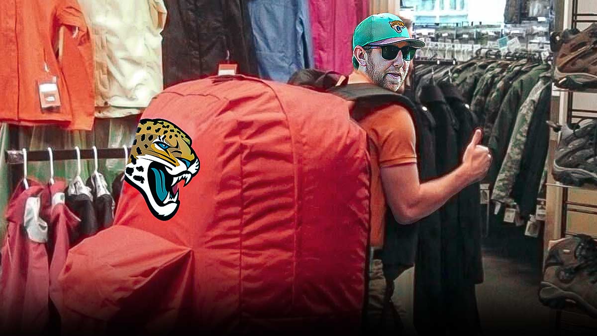 Buccaneers offensive coordinator Liam Coen wearinmg huge backpack with Jaguars logo on it.