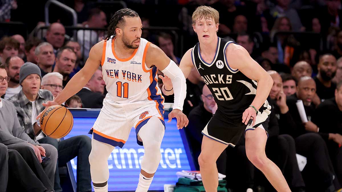 New York Knicks guard Jalen Branson (11) controls the ball against Milwaukee Bucks guard AJ Green (20) during the fourth quarter at Madison Square Garden. 