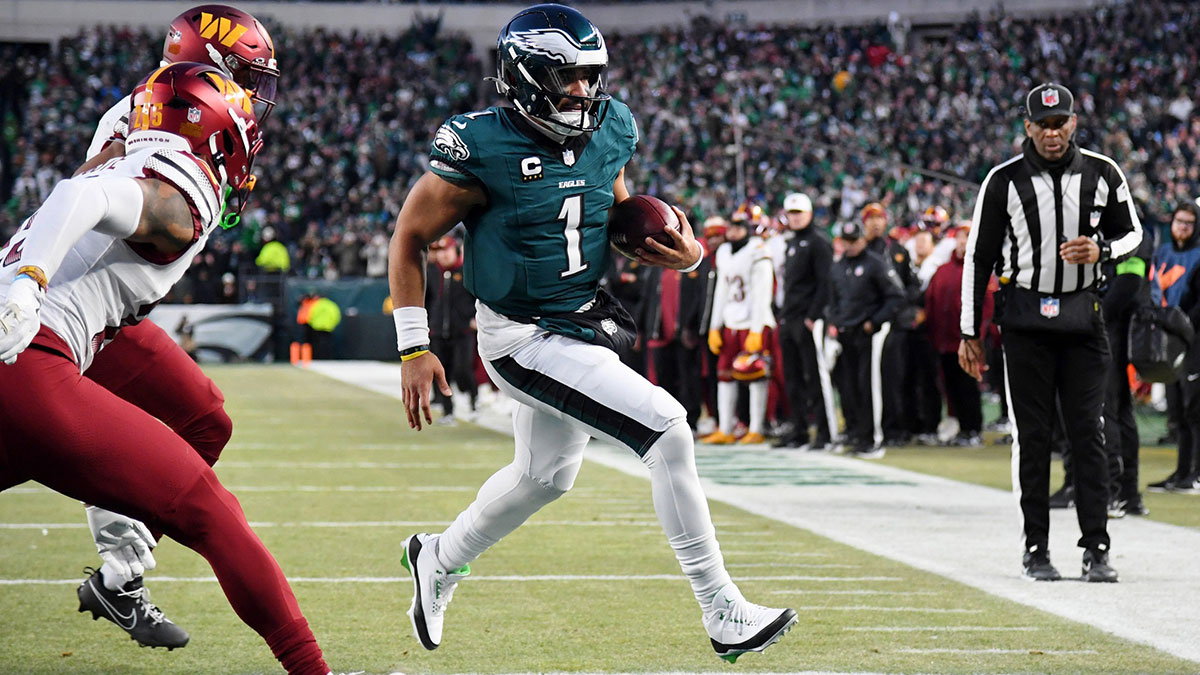 Jan 26, 2025; Philadelphia, PA, USA; Philadelphia Eagles quarterback Jalen Hurts (1) runs with the ball for a touchdown against the Washington Commanders during the second half in the NFC Championship game at Lincoln Financial Field.