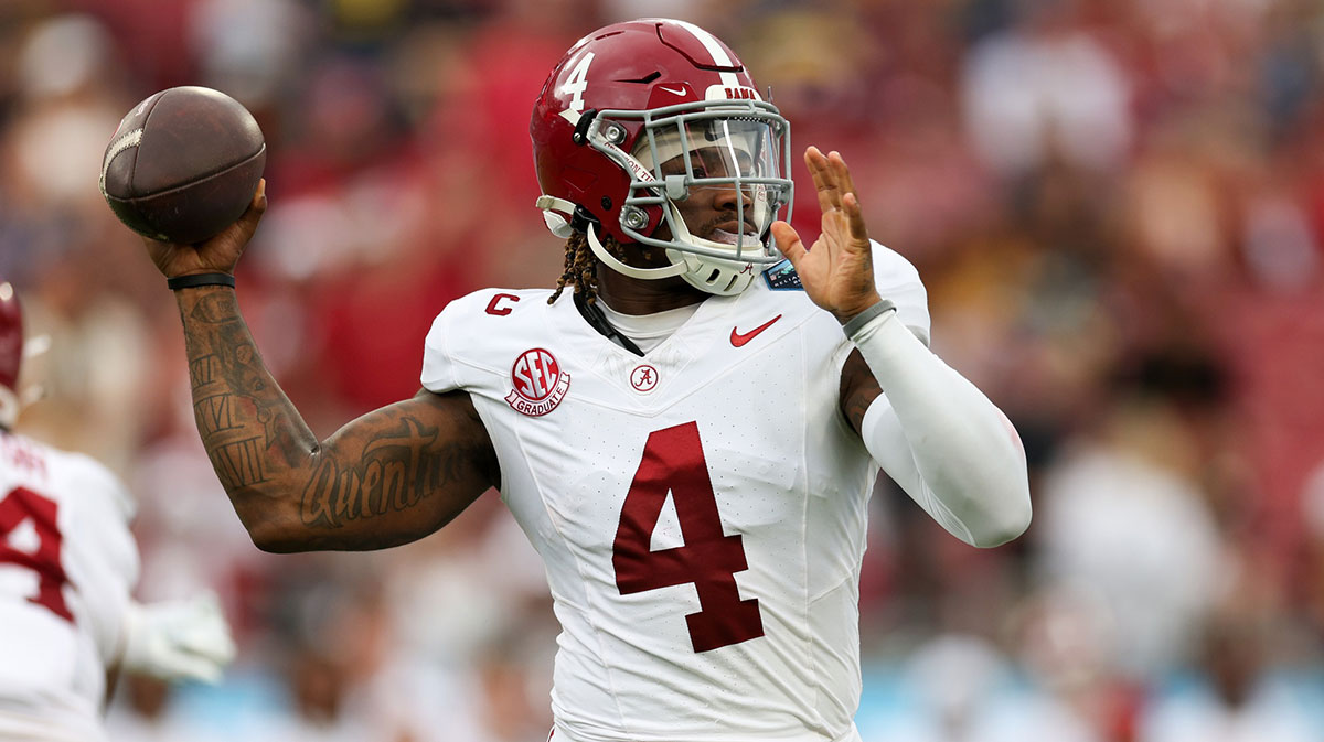 Alabama Crimson Tide quarterback Jalen Milroe (4) drops back to pass against the Michigan Wolverines in the first quarter during the ReliaQuest Bowl at Raymond James Stadium.