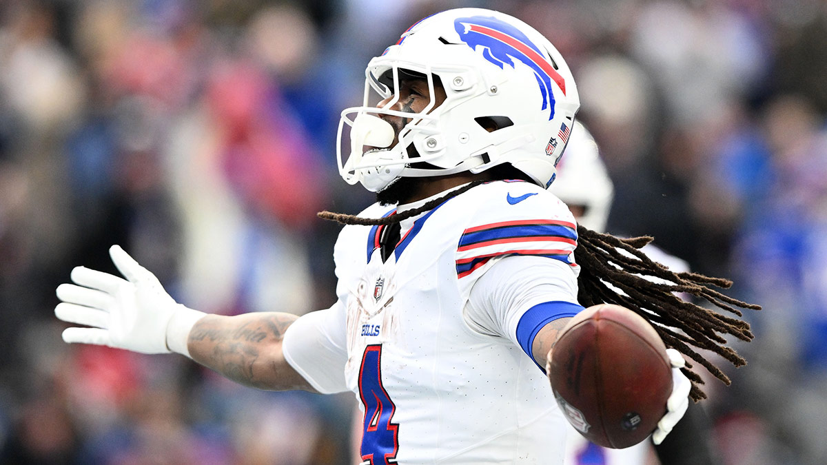 Buffalo Bills running back James Cook (4) reacts after scoring a touchdown against the New England Patriots during the second half at Gillette Stadium.