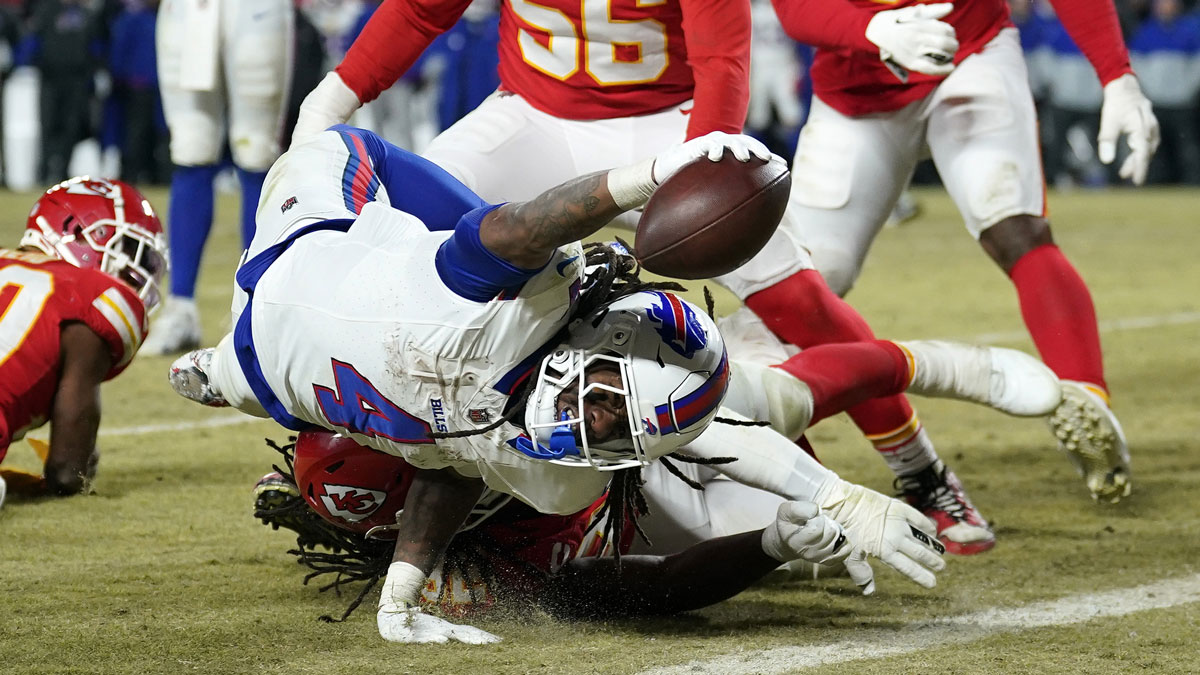 Jan 26, 2025; Kansas City, MO, USA; Buffalo Bills running back James Cook (4) dives for a touchdown against the Kansas City Chiefs during the second half in the AFC Championship game at GEHA Field at Arrowhead Stadium.