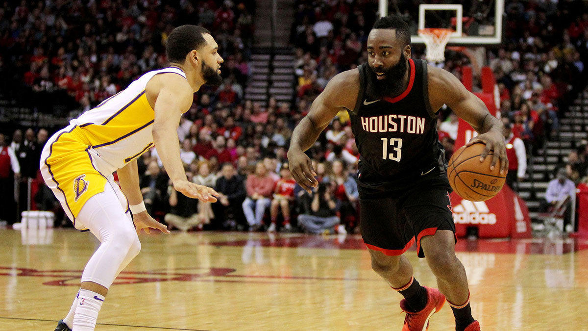 Houston Rockets guard James Harden (13) drives to the basket while Los Angeles Lakers guard Tyler Ennis (10) defends during the second quarter at Toyota Center. 