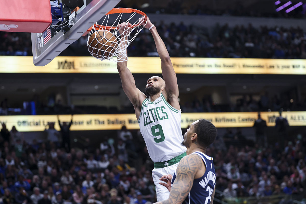 Back Boston Seltiks Derik White (9) dunks over the attacker Dallas Maveriks PJ Washington (25) during the second half in the American Airlines Center.