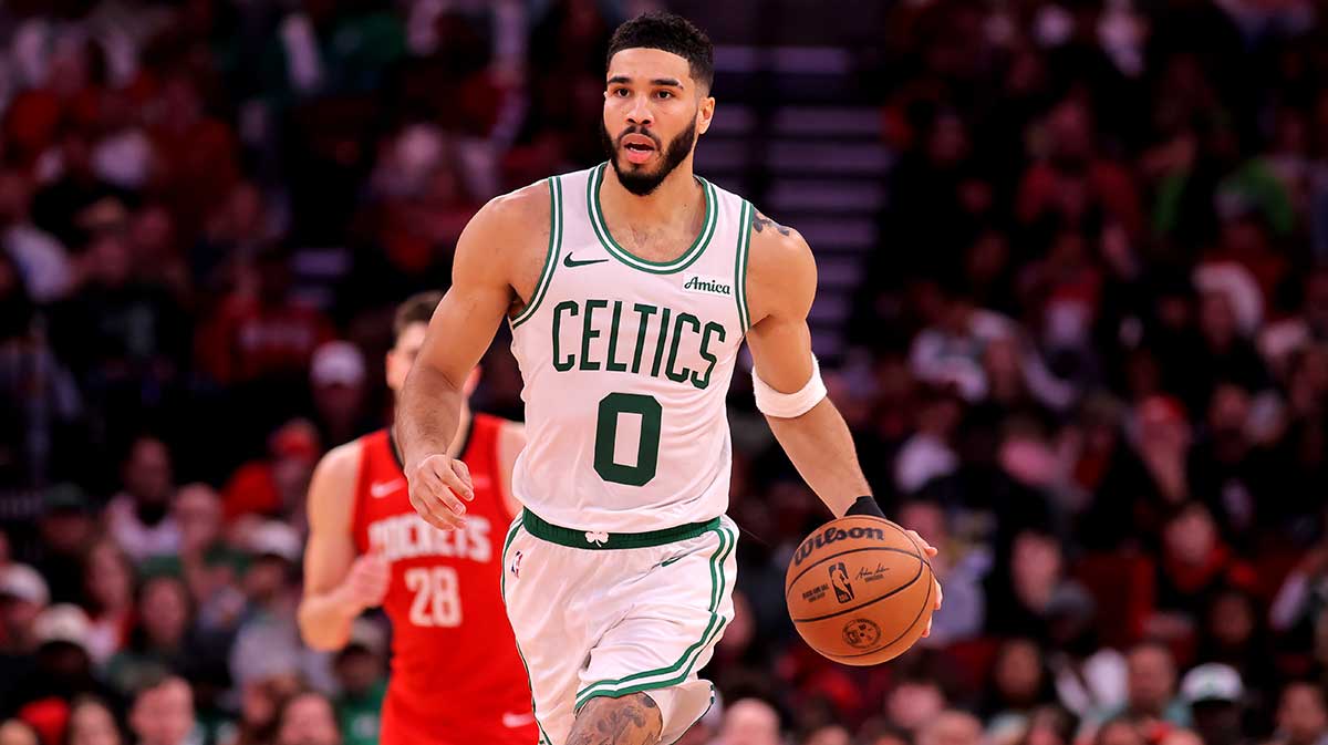 Boston Celtics forward Jayson Tatum (0) drives the ball against the Houston Rockets during the third quarter at the Toyota Center. 