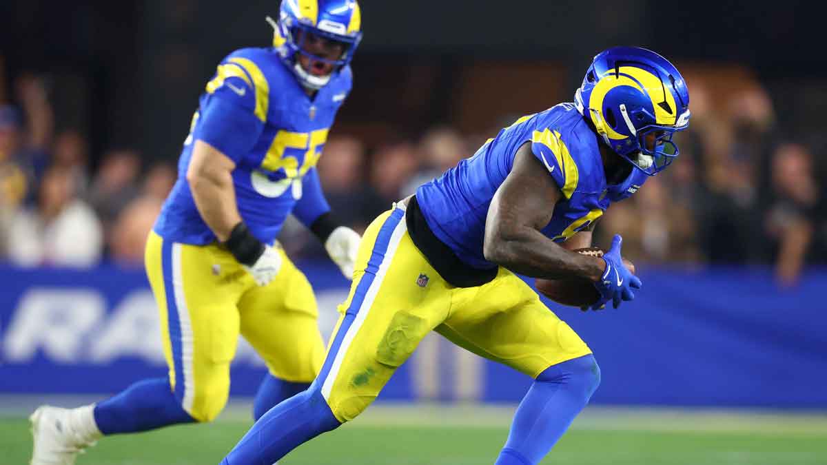 January 13, 2025; Glendale, AZ, USA; Los Angeles Rams linebacker Jared Vers (8) recovers from a fumble against the Minnesota Vikings during the first half of the NFC wild card game at State Farm Stadium. Mandatory Credit: Mark J. Rebilas-Imagn Images