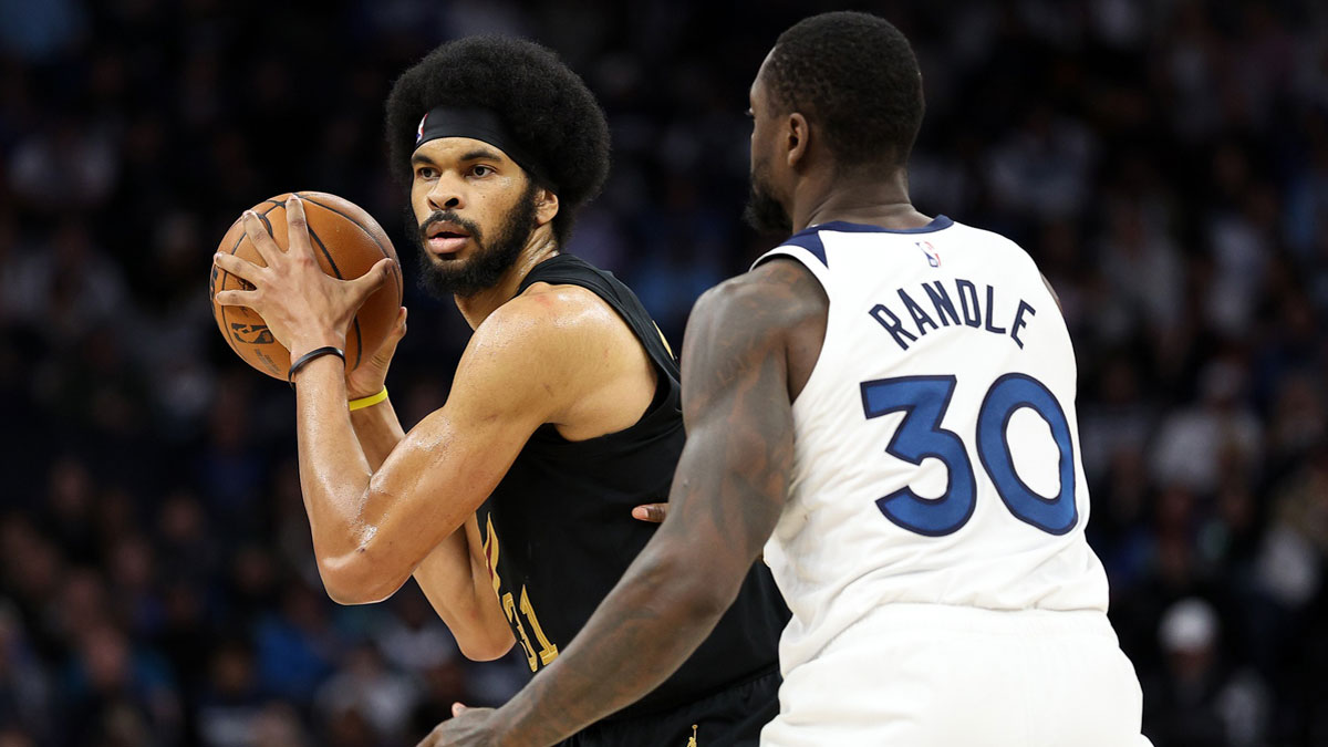 Cleveland Cavaliers center Jarrett Allen (31) controls the ball as Minnesota Timberwolves forward Julius Randle (30) defends during the fourth quarter at Target Center. 