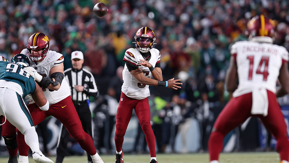 Washington Commanders quarterback Jayden Daniels (5) passes the ball against the Philadelphia Eagles during the second half in the NFC Championship game at Lincoln Financial Field.
