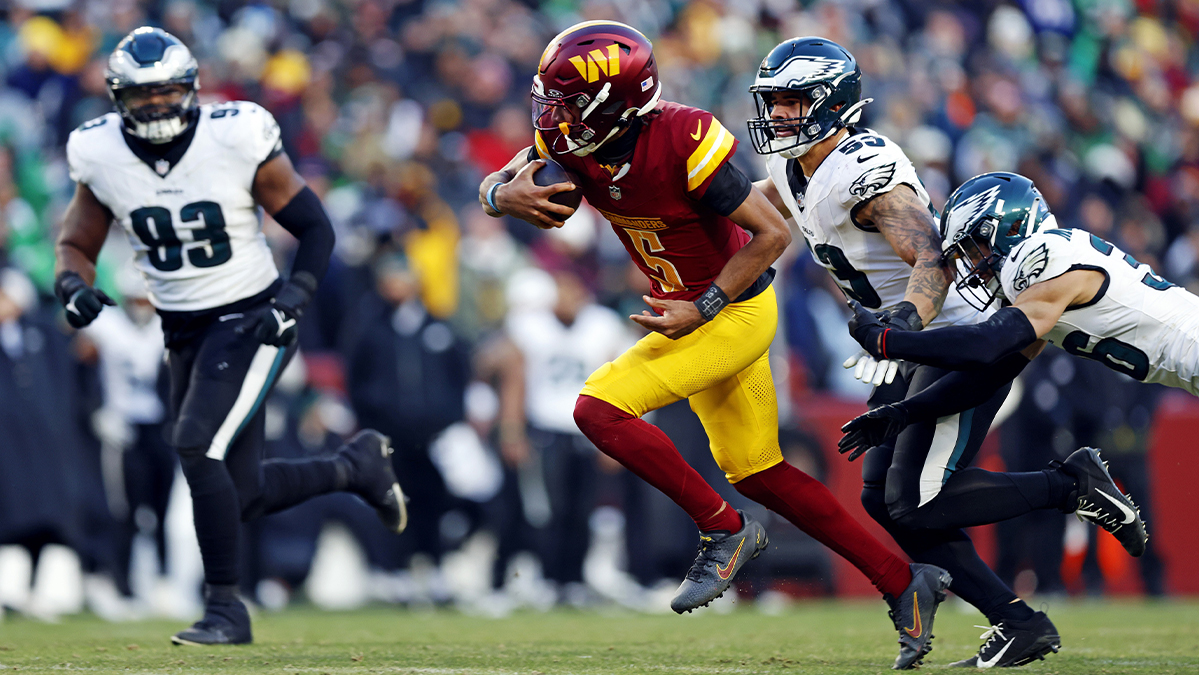 Washington Commanders quarterback Jayden Daniels (5) runs the ball against Philadelphia Eagles linebacker Zack Baun (53) during the fourth quarter at Northwest Stadium