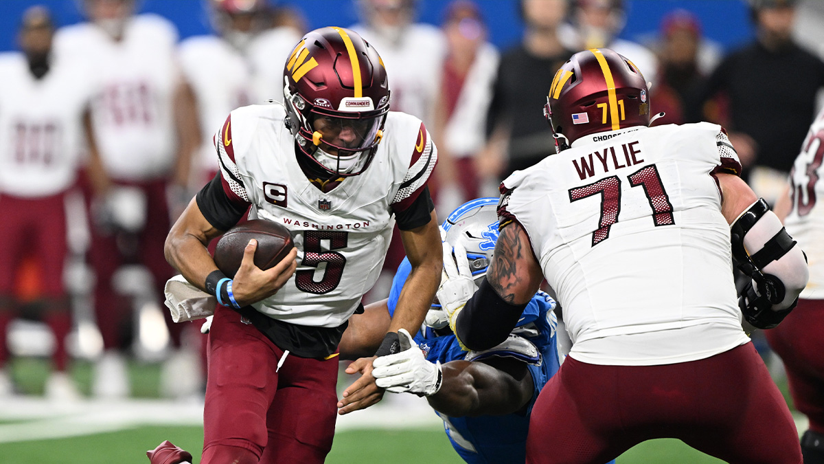 Washington Commanders Jaden Daniels (5) get out of the pocket in the fourth quarter against Detroit Lions in the NFC Division Circle in 2025 of Ford Field.