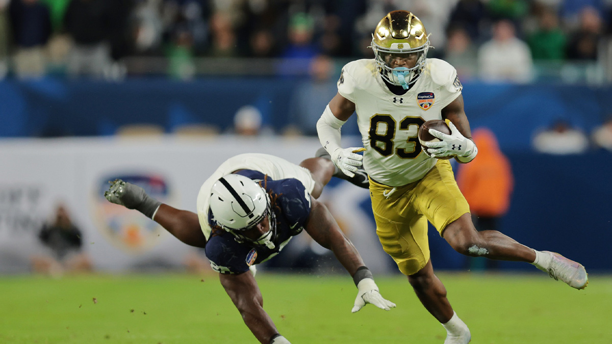 Notre Dame Fighting Irish wide receiver Jayden Thomas (83) runs passed Penn State Nittany Lions defensive tackle Zane Durant (28) in the second half in the Orange Bowl at Hard Rock Stadium.