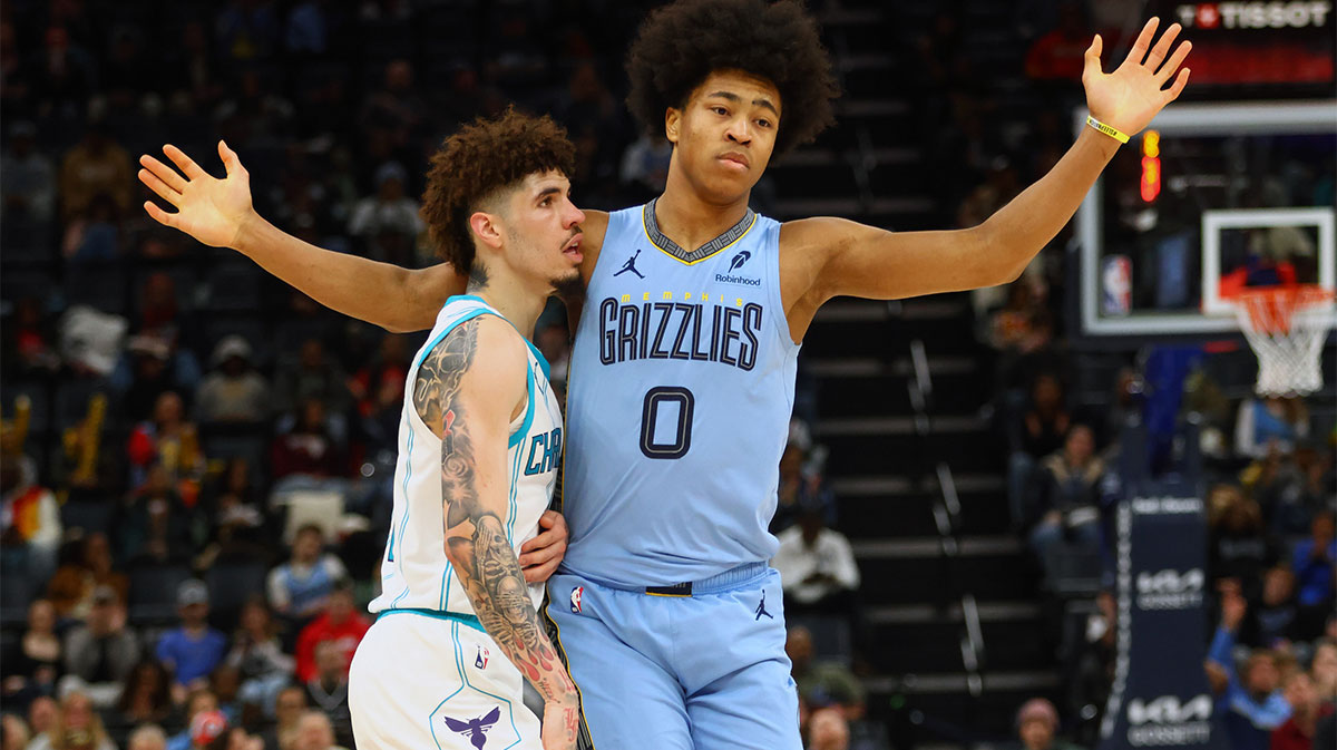 Charlotte Hornets guard LaMelo Ball (1) and Memphis Grizzlies forward Jaylen Wells (0) battle for position during the third quarter at FedExForum.