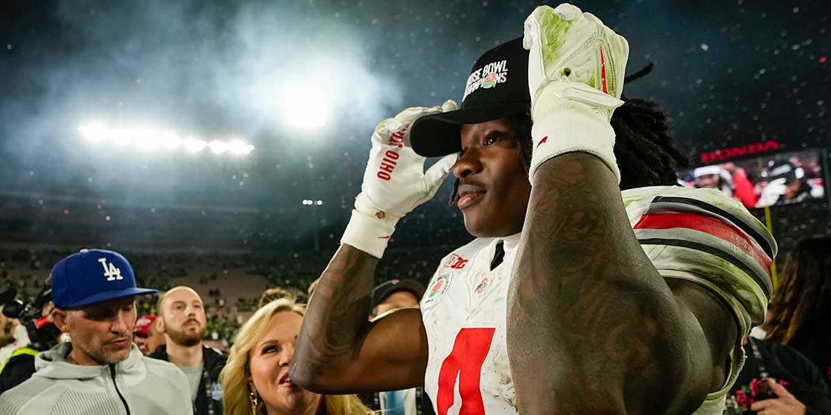 Ohio State Buckeyes wide receiver Jeremiah Smith (4) celebrates a first down catch during the second half of the College Football Playoff quarterfinal against the Oregon Ducks at the Rose Bowl in Pasadena, Calif. on Jan. 1, 2025. Ohio State won 41-21.