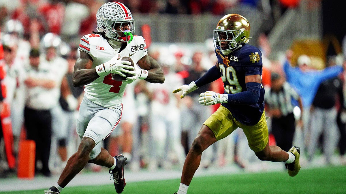 Ohio State Buckeyes wide receiver Jeremiah Smith (4) makes a catch against Notre Dame Fighting Irish cornerback Christian Gray (29) in the fourth quarter during the College Football Playoff National Championship at Mercedes-Benz Stadium in Atlanta on January 20, 2025.