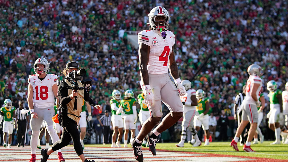 Ohio State Buckeyes wide receiver Jeremiah Smith (4) celebrates a touchdown during the first half of the College Football Playoff quarterfinal against the Oregon Ducks at the Rose Bowl in Pasadena, Calif., on Jan. 1, 2025.