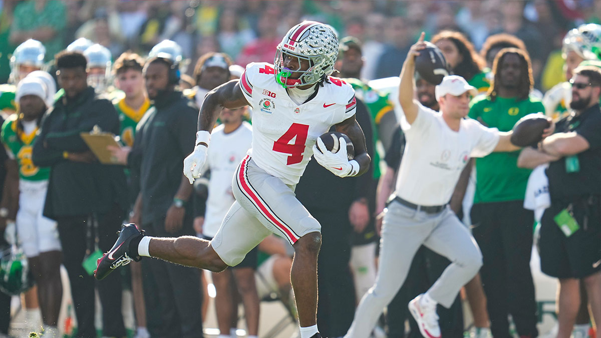 Ohio State Buckeyes wide receiver Jeremiah Smith (4) scores a touchdown during the first half of the College Football Playoff quarterfinal against the Oregon Ducks
