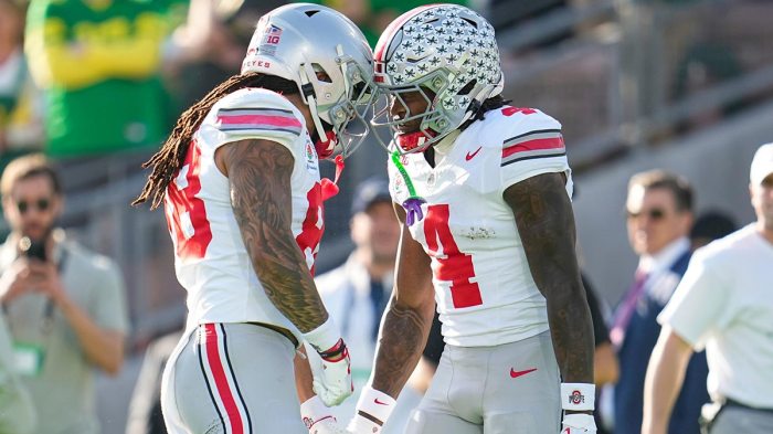 Ohio State Buckeyes wide receiver Jeremiah Smith (4) celebrates a touchdown with otight end Gee Scott Jr. (88) during the first half of the College Football Playoff quarterfinal against the Oregon Ducks