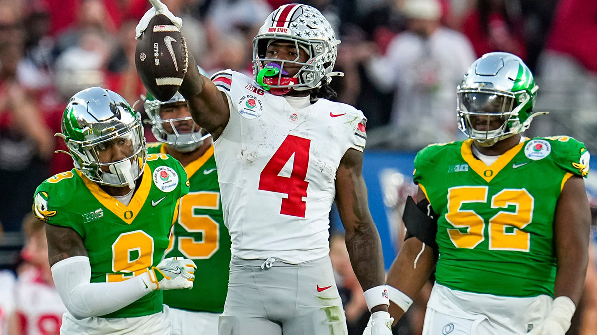 Ohio State Buckeyes wide receiver Jeremiah Smith (4) celebrates a first down catch during the second half of the College Football Playoff quarterfinal against the Oregon Ducks at the Rose Bowl in Pasadena