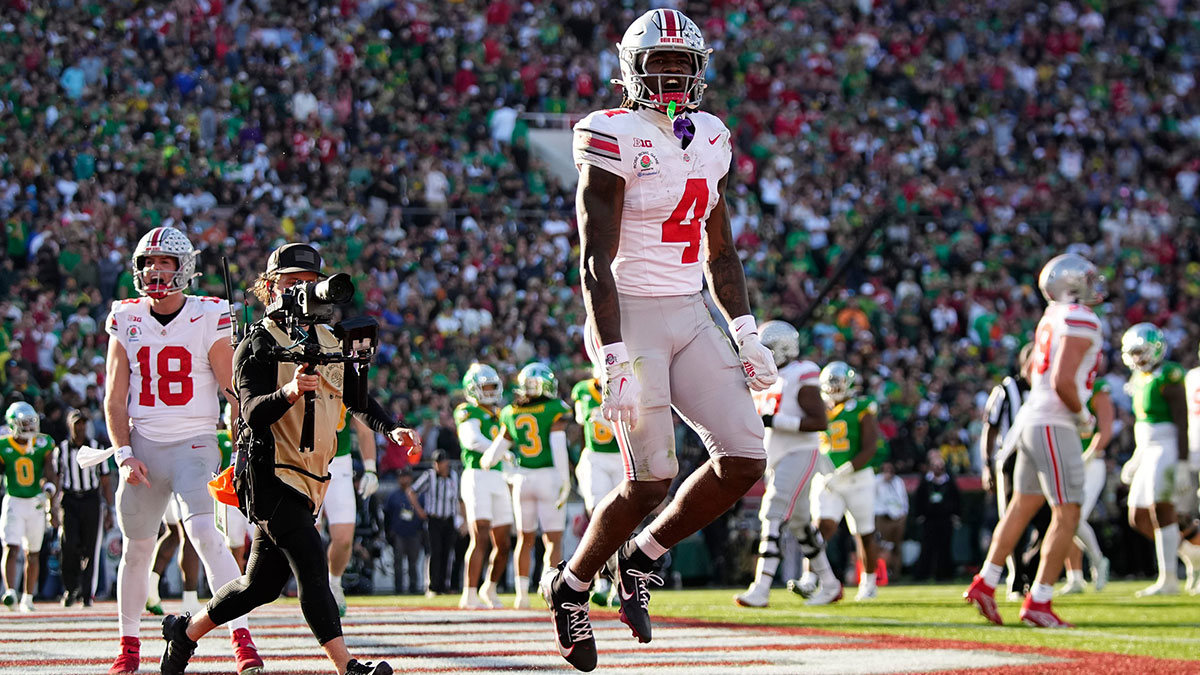 Ohio State Buckeyes wide receiver Jeremiah Smith (4) celebrates a touchdown during the first half of the College Football Playoff quarterfinal against the Oregon Ducks at the Rose Bowl