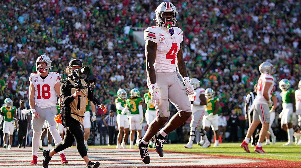 Ohio State Buckeyes wide receiver Jeremiah Smith (4) celebrates a touchdown during the first half of the College Football Playoff quarterfinal against the Oregon Ducks at the Rose Bowl