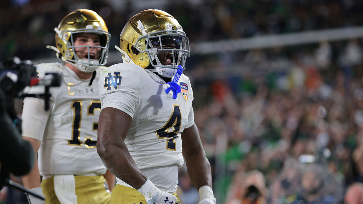 Notre Dame Fighting Irish running back Jeremiyah Love (4) celebrates a touch down in the second half against the Penn State Nittany Lions in the Orange Bowl at Hard Rock Stadium.