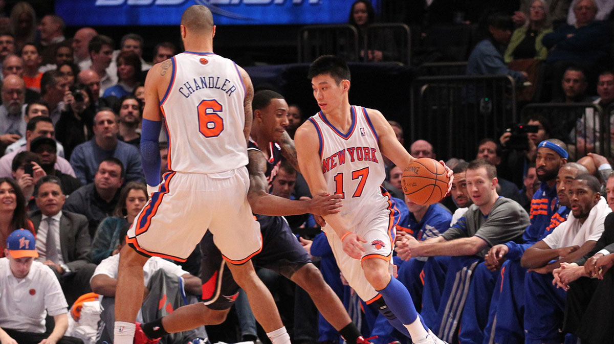 New York Knicks Point Guard Jeremi Lin (17) is run next to Atlanta Hawks Point Guard Jeff Teague (Center) during the first quarter in Madison Square Garden. 