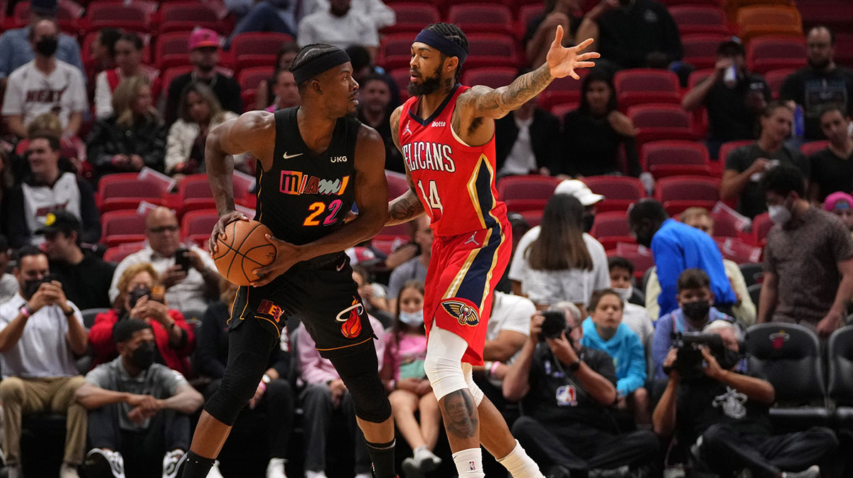 Miami heat forward Jimmy Butler (22) Controls the ball around New Orleans Pelicana Next Brandon Ingram (14) during the first half in FTX Arena.