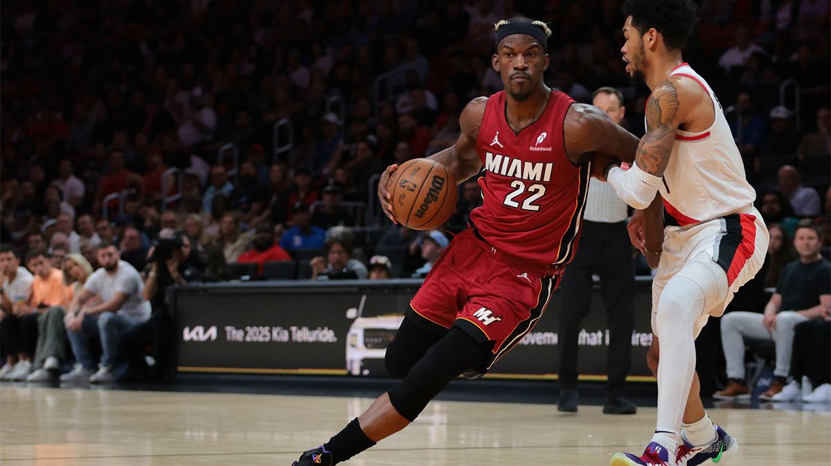 Miami Heat forward Jimmy Butler (22) drives to the basket past Portland Trail Blazers guard Anfernee Simons (1) during the second quarter at Kaseya Center.