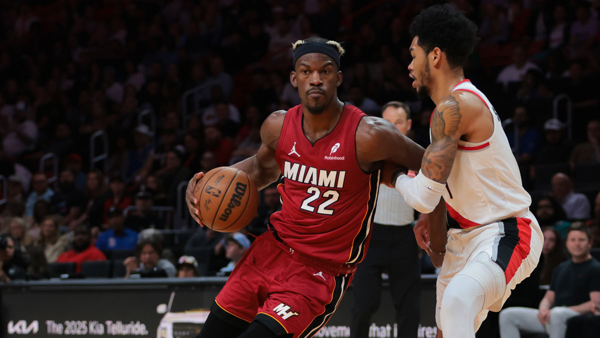Miami Heat forward Jimmy Butler (22) drives to the basket past Portland Trail Blazers guard Anfernee Simons (1) during the second quarter at Kaseya Center.