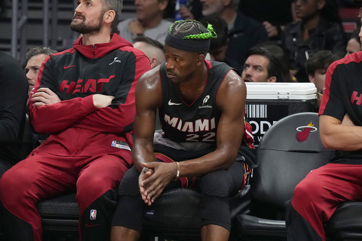 Miami Heat forward Jimmy Butler (22) looks on from the bench during the second half at Kaseya Center.