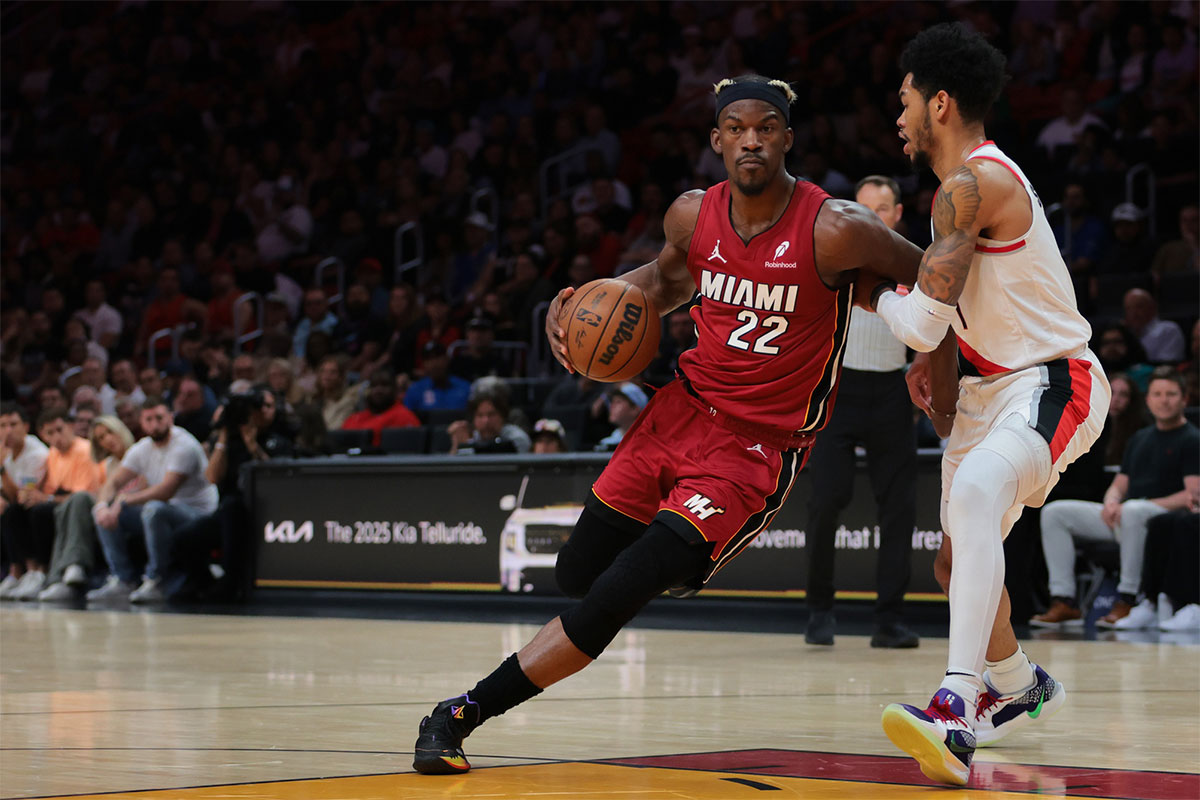 Miami Heat forward Jimmy Butler (22) drives to the basket past Portland Trail Blazers guard Anfernee Simons (1) during the second quarter at Kaseya Center.