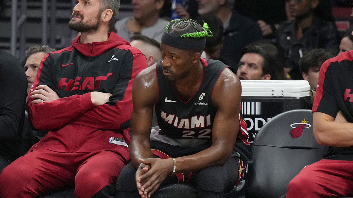 Miami Heat forward Jimmy Butler (22) looks on from the bench during the second half at Kaseya Center.