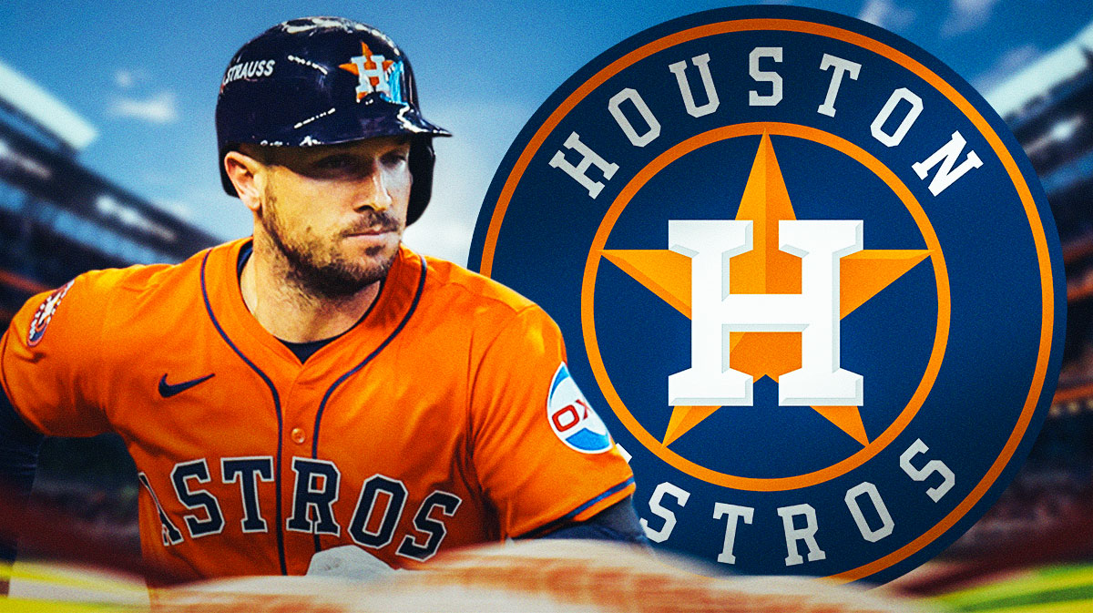 Alex Bregman in front of Astros logo, Minute Maid Park