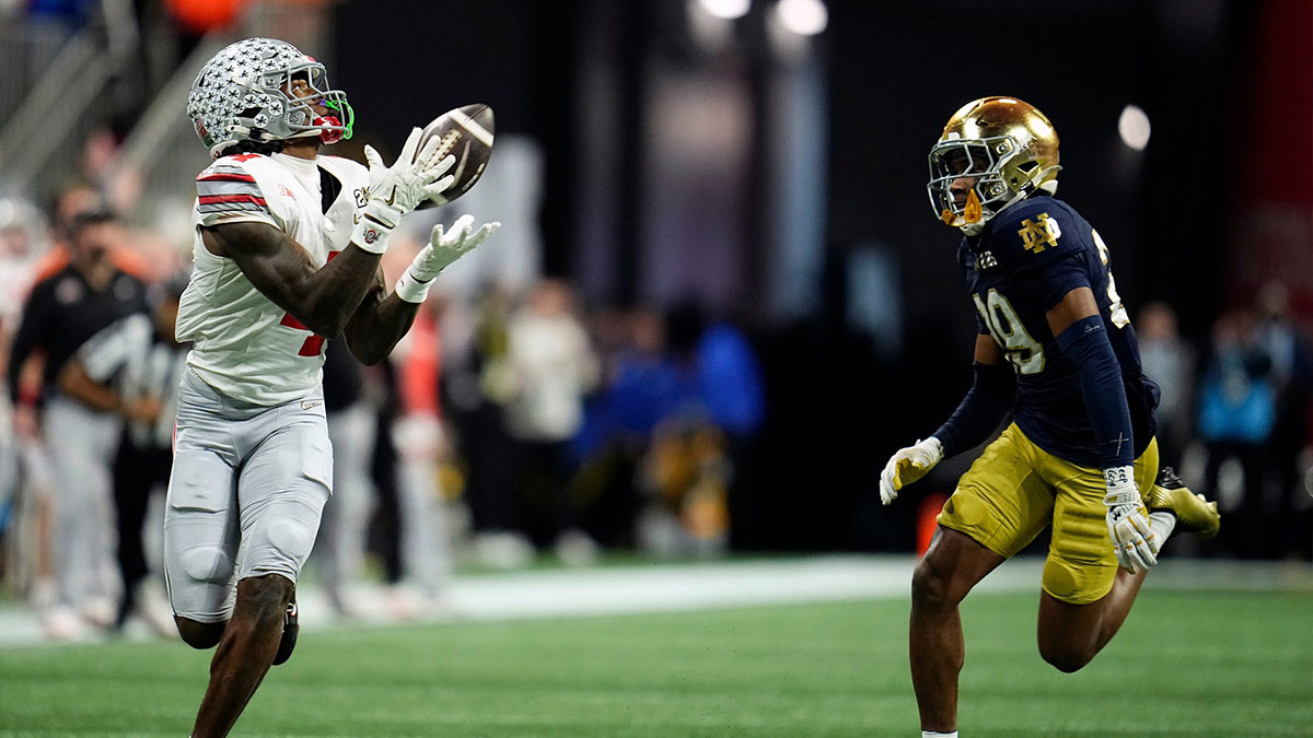 Ohio State Buckeyes wide receiver Jeremiah Smith (4) makes a catch against Notre Dame Fighting Irish cornerback Christian Gray (29) in the fourth quarter during the College Football Playoff National Championship at Mercedes-Benz Stadium in Atlanta on January 20, 2025.