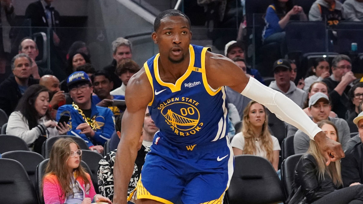 Jan 4, 2025; San Francisco, California, USA; Golden State Warriors forward Jonathan Kuminga (00) drives to the basket against the Memphis Grizzlies in the second quarter at Chase Center.