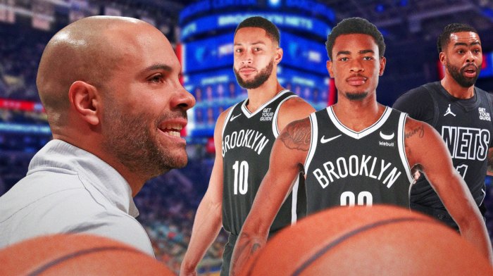 Jordi Fernandez on one side clapping with Nic Claxton, Ben Simmons and D'Angelo Russell on the other
