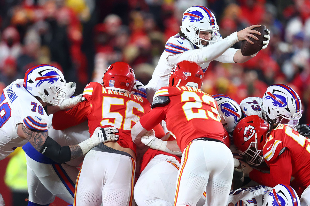 Buffalo Bills quarterback Josh Allen (17) dives for a first down against the Kansas City Chiefs during the second half in the AFC Championship game at GEHA Field at Arrowhead Stadium.