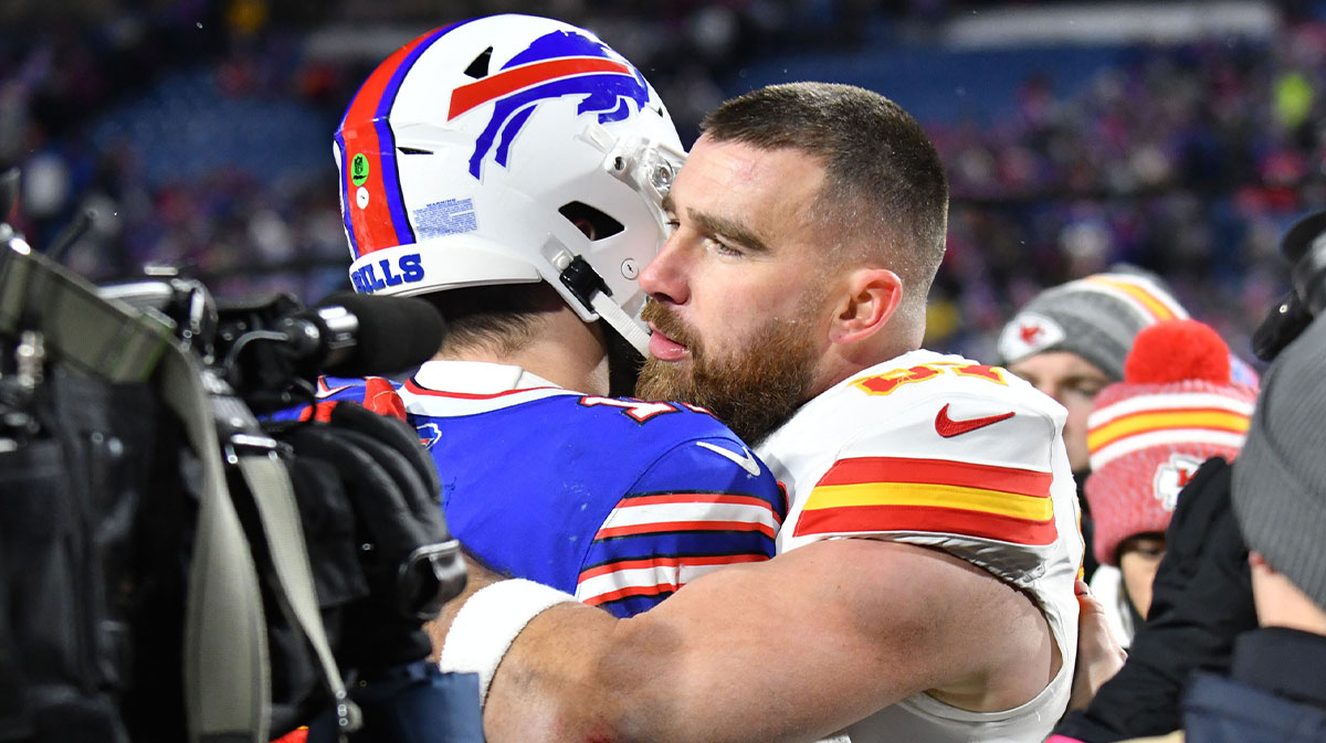 Kansas City Chiefs tight end Travis Kelce (87) reacts with Buffalo Bills quarterback Josh Allen (17) after the 2024 AFC Division 1 game at Highmark Stadium.