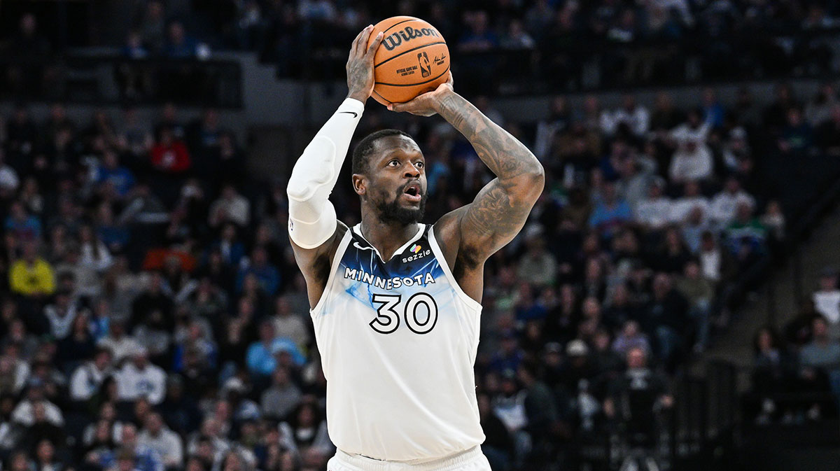 Minnesota Timberwolves forward Julius Randle (30) shoots a three point basket against the Denver Nuggets during the fourth quarter at Target Center.