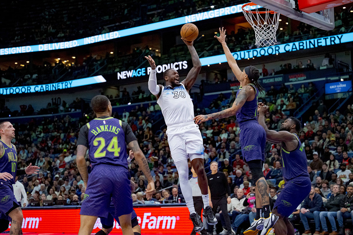 Minnesota Timberwolves forward Julius Randle (30) shoots against New Orleans Pelicans guard Brandon Boston (11) during the second half at Smoothie King Center. 