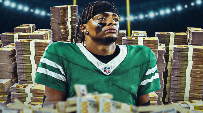 Justin Fields surrounded by piles of cash.