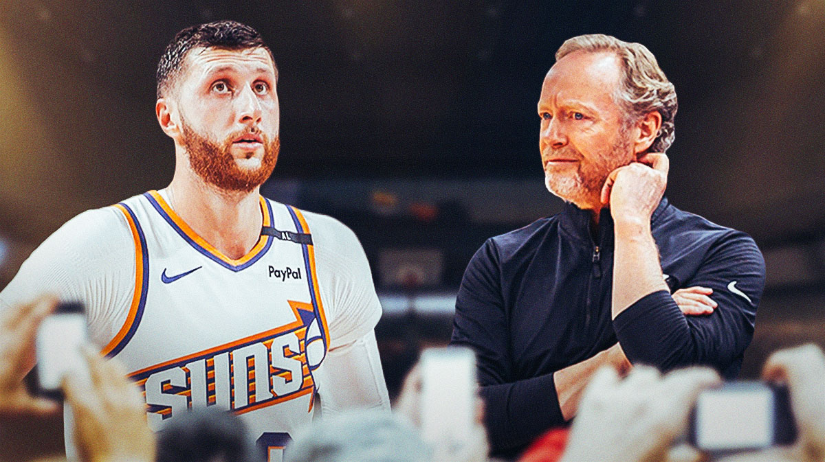 Suns center Jusuf Nurkic next to Suns head coach Mike Budenholzer and the Suns logo in the background