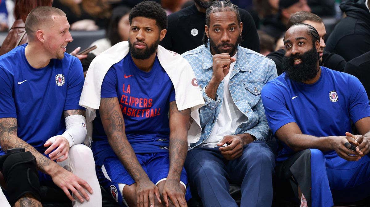 Los Angeles Clippers Center Daniel Theis (10, Left) and Pro Paul George (13) and Cowhi Leonard (2) and stores James Harden (1, right) watch the game from the bench at the Crypto.com Arena. 