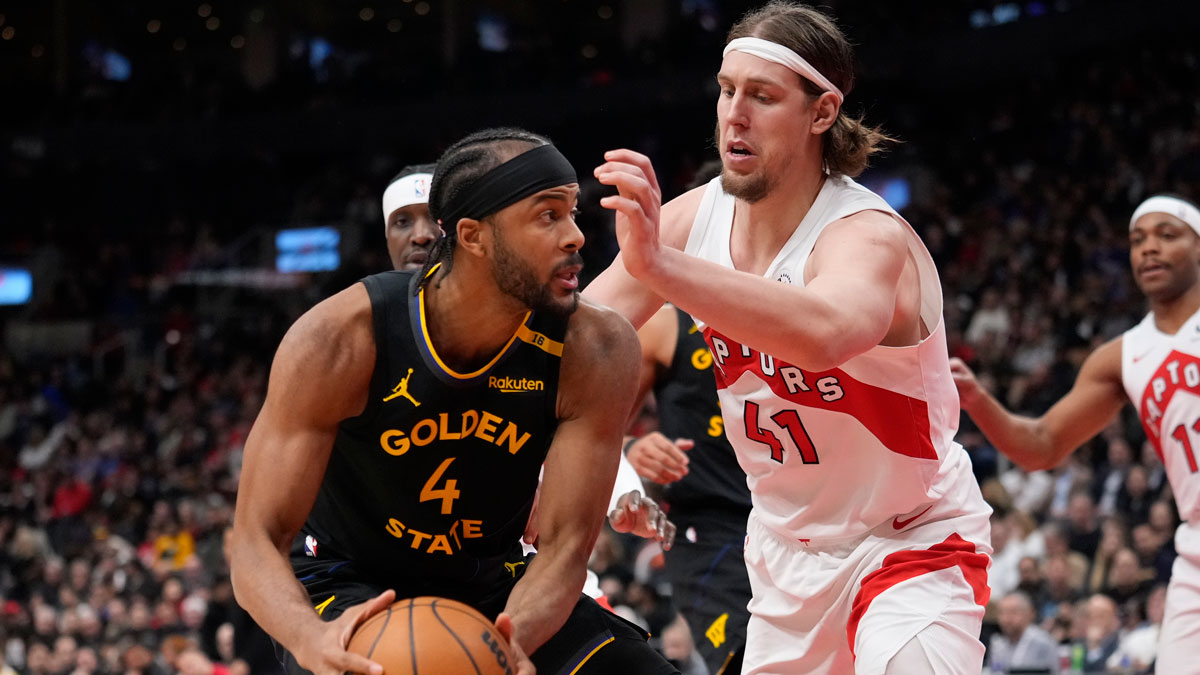 Toronto Raptors forward Kelly Olynyk (41) defends against Golden State Warriors guard Moses Moody (4) during the second half at Scotiabank Arena.