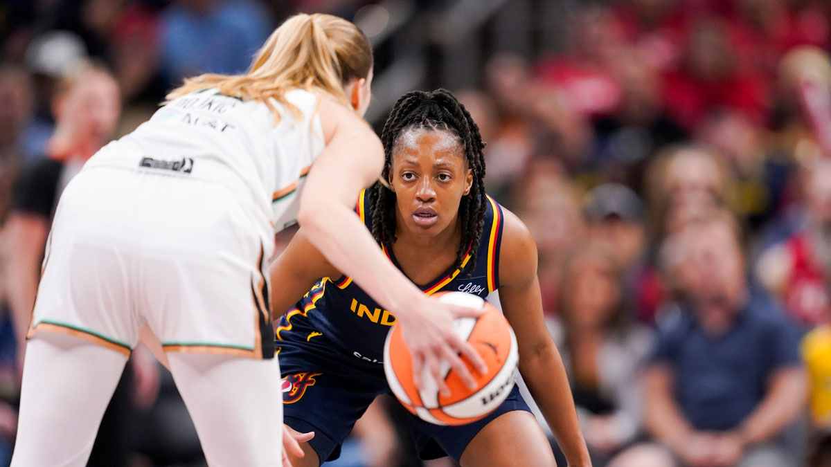 Indiana Fever guard Kelsey Mitchell (0) plays defense against New York Liberty guard Ivana DojkiÄ‡ during the Indiana Fever home opener game against the New York Liberty at Gainbridge Fieldhouse in Indianapolis.