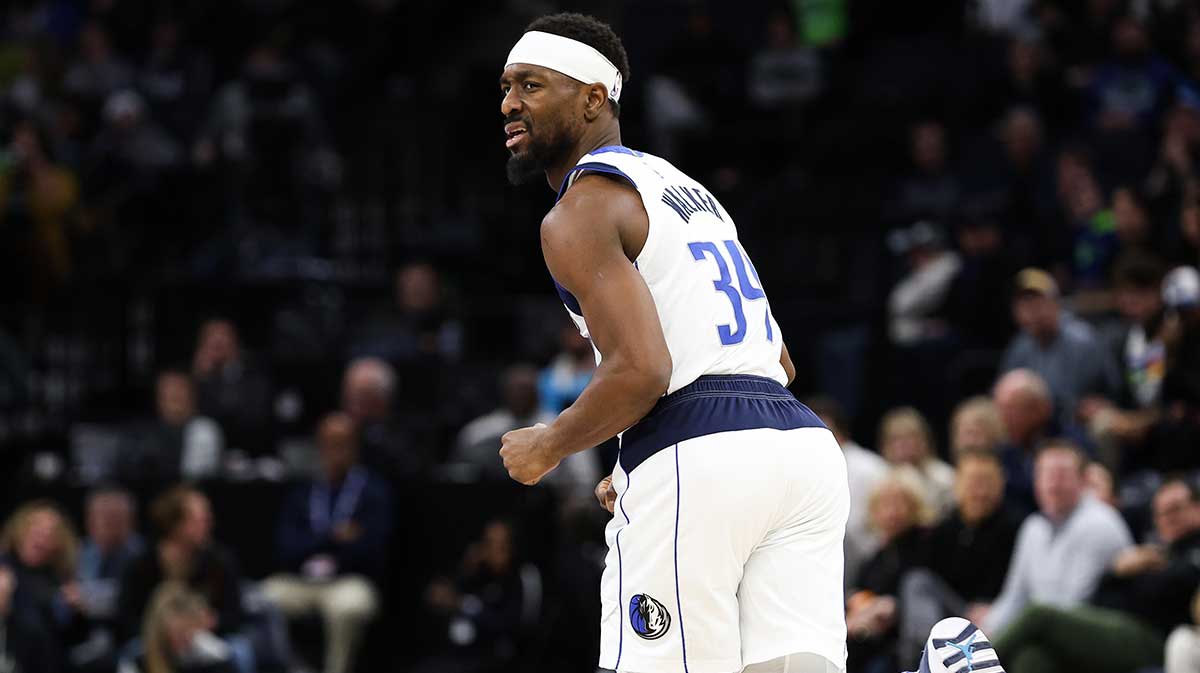 USA; Dallas Mavericks guard Kemba Walker (34) reacts to his shot against the Minnesota Timberwolves during the second period at Target Center.
