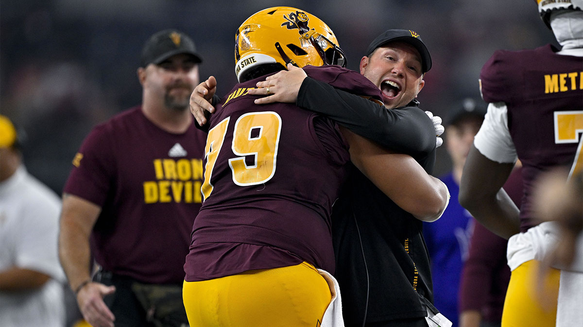 Arizona State Sun Devils head coach Kenny Dillingham celebrates with offensive lineman Leif Fautanu (79) during the second half at AT&T Stadium.