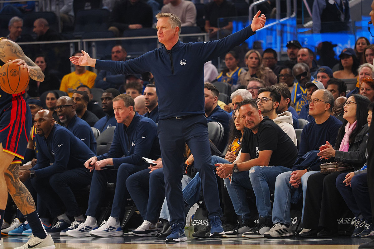 Golden State Warriors head coach Steve Kerr reaches out his arms along the sideline during the second quarter against the Sacramento Kings at Chase Center.