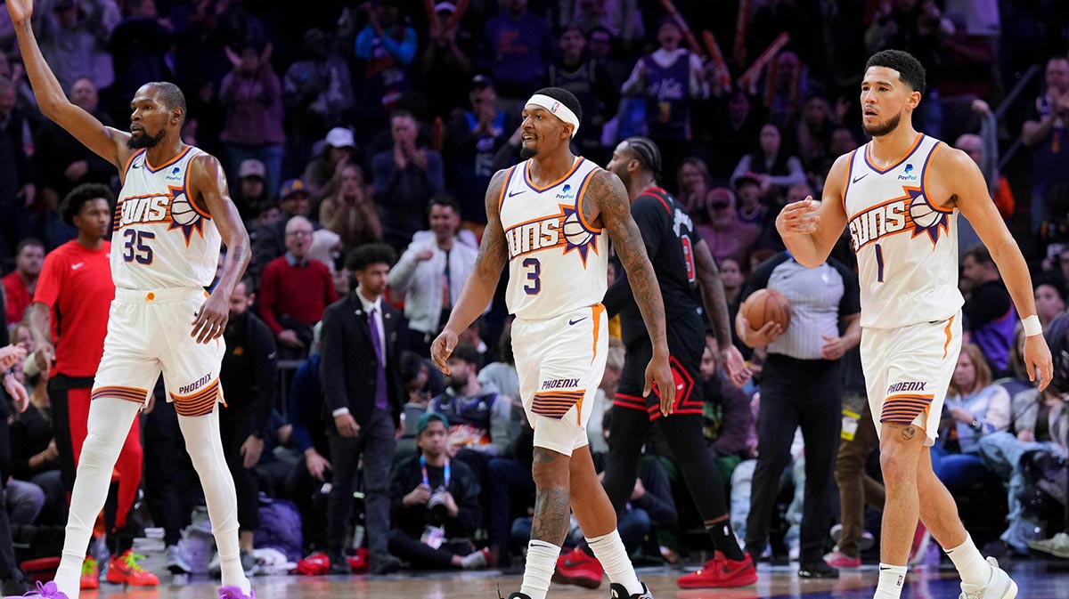 Phoenix Suns Napred Kevin Durant (35) And Phoenix Suns Guard Bradley Beal (3) and Phoenix Suns Guard Devin Booker (1) reacts during the second half of the game against Chicago Bulls in the Footprint Center. 